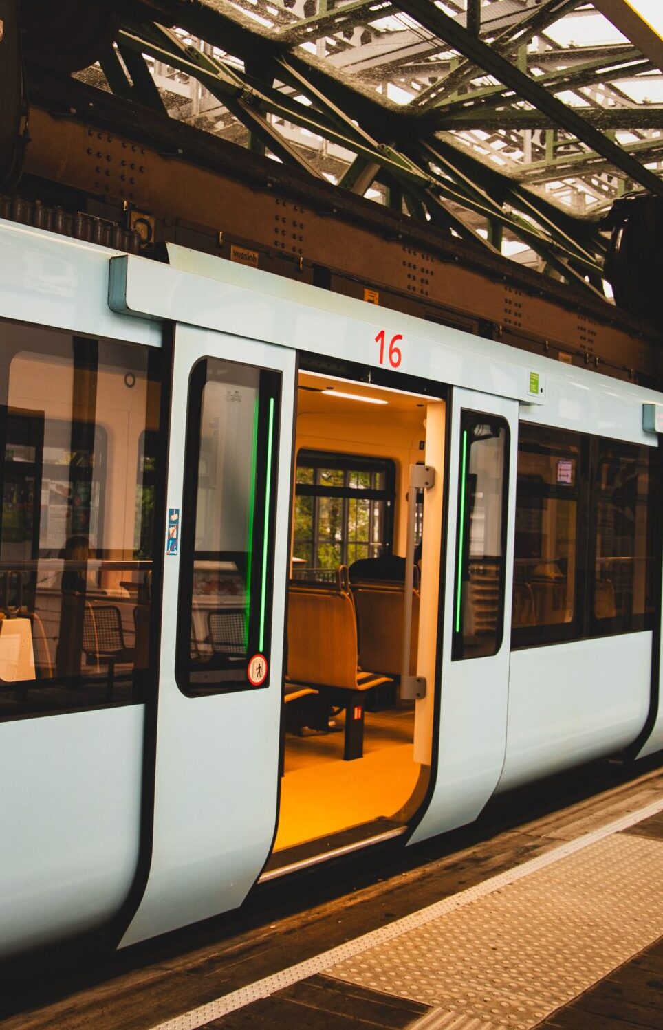 A sleek suspension train at Wuppertal station, showcasing modern urban transport.